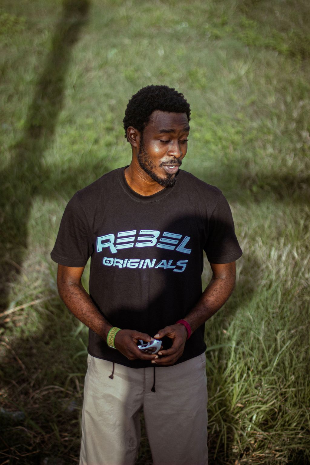 Portrait of a creative standing outdoors in a black graphic tee
