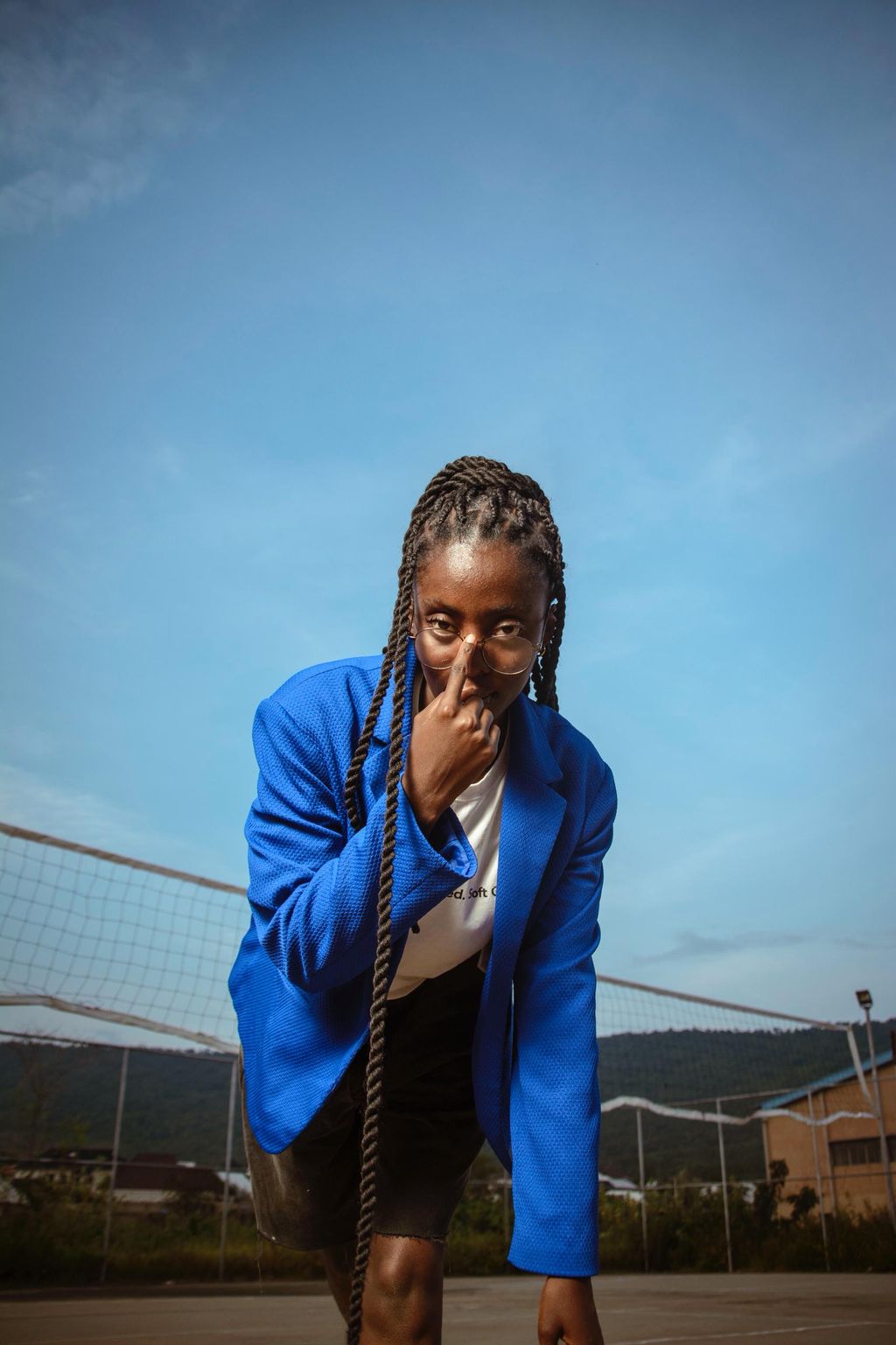 Portrait of a creative in a blue jacket against an open sky